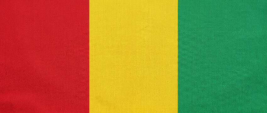 The flag of Guinea, a symbol of national pride and unity. This vertical tricolor features red, yellow, and green bands, representing the blood, land, and vegetation of the country