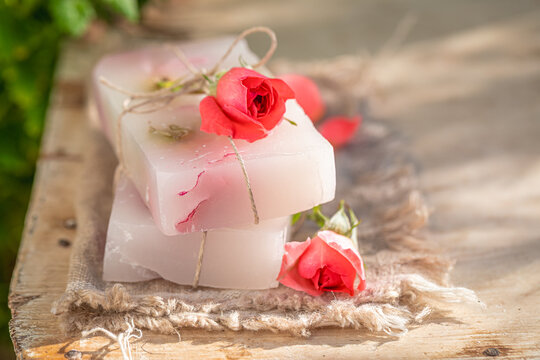 Natural and moisture rose soap in summer garden