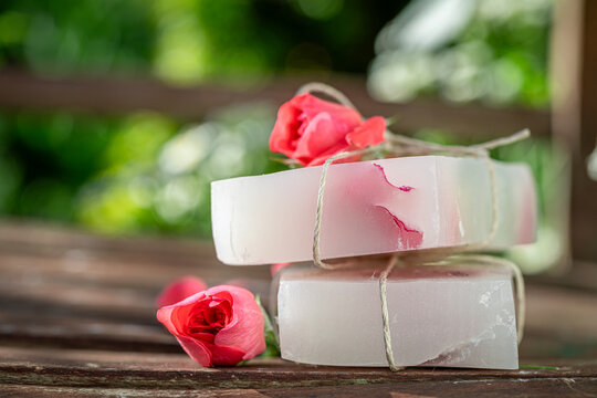 Aromatic and handmade rose soap in summer garden