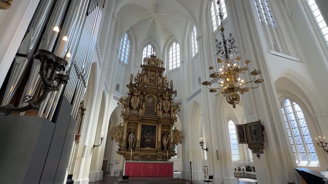 Interior view of the high altar inside Saint Peter's Church in Malmo, Sweden