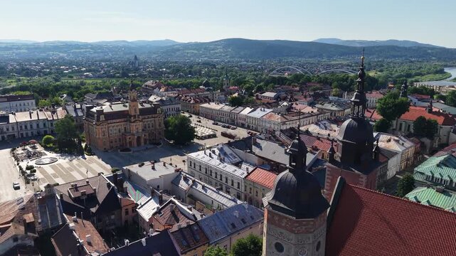 Drone shot of town square and Basilica of Saint Margaret in Nowy Sacz, Poland