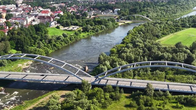 Drone shot of Dunajec river and bridges in Nowy Sacz city, Poland