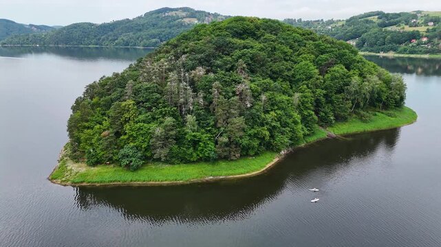 Drone shot of Grodzisko (Monkey Island) at Roznow lake in Poland