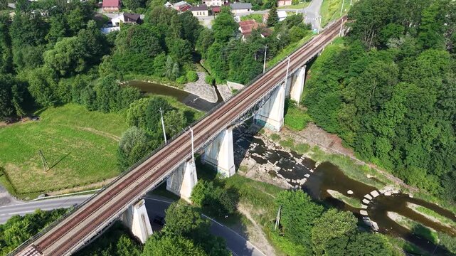 Drone shot of railway viaduct over Biala river in Grybow town, Poland
