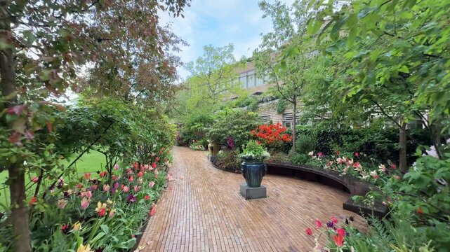 Walking view along tulip pathway in Tivoli Gardens, Copenhagen, Denmark