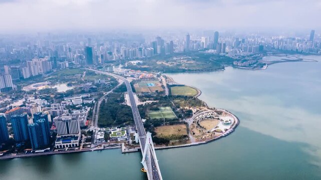 Aerial timelapse view of Century Bridge over Haidian River in Haikou, Hainan Island, China.