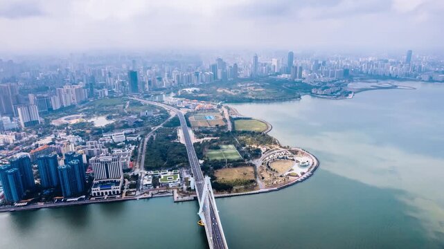 Aerial timelapse view of Century Bridge over Haidian River in Haikou, Hainan Island, China.