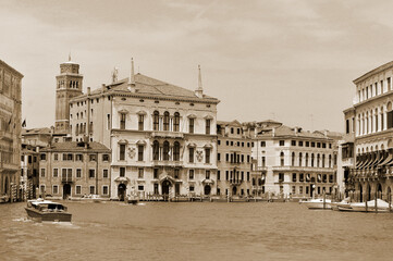 Obraz premium Venica Italy The Grand Canal in Venice serves as the city’s primary liquid highway, hosting a bustling mix of public water buses (vaporettos) and traditional gondolas.