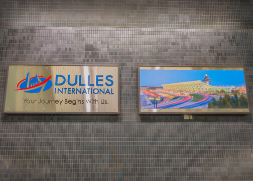 Virginia, USA - 2.2.2026 - 06.30.2026: Sign at Dulles International Airport shows airport name and welcoming message 