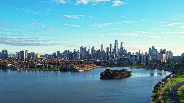 Sunrise view of Yarra river and Melbourne skyscrapers business office building with evening skyline in Albert Park, Victoria, Australia