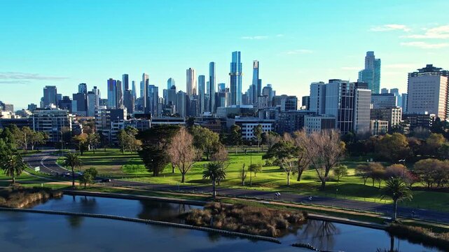 Sunrise view of Yarra river and Melbourne skyscrapers business office building with evening skyline in Albert Park, Victoria, Australia