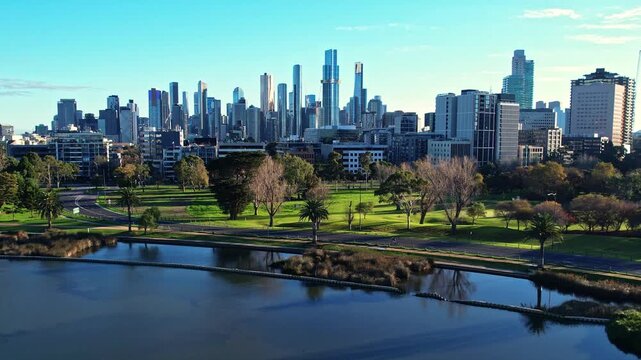 Sunrise view of Yarra river and Melbourne skyscrapers business office building with evening skyline in Albert Park, Victoria, Australia