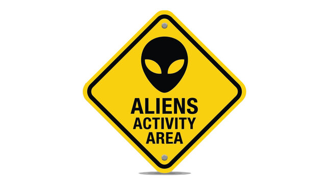 Bright yellow diamond shaped road sign featuring a bold black alien head silhouette and text warning of extraterrestrial activity in a isolated white background setting