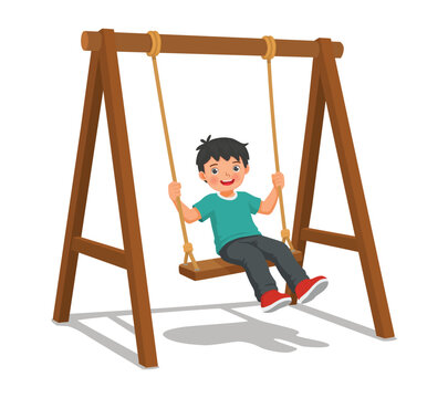 Little boy playing on the swings in the park