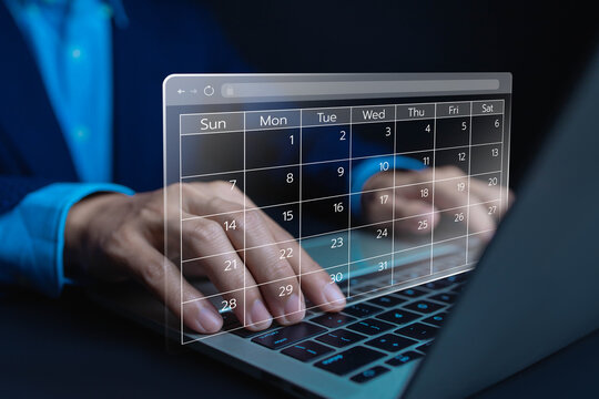 Business professional using a laptop with a virtual online calendar interface for appointment scheduling project planning task management, productivity digital workflow and time management technology.