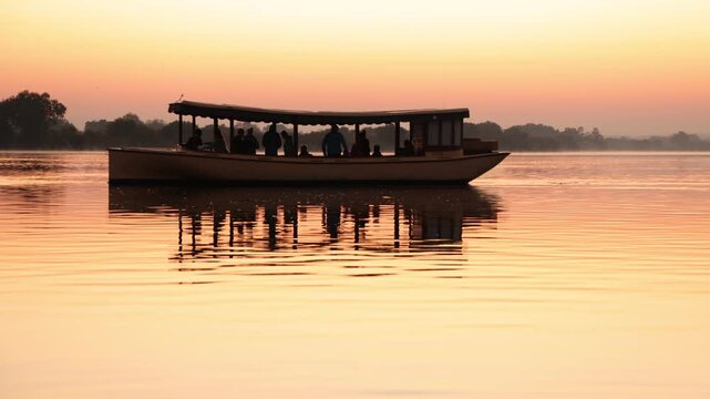 boats on the Zambezi River at sunrise, Zambia, Africa
