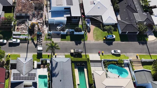 Aerial View of Suburban House Demolition and Waterfront Construction Site
