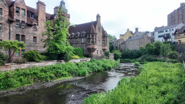 The historic 12th-century milling enclave of Dean Village with red sandstone architecture and the Water of Leith in Edinburgh, Scotland.