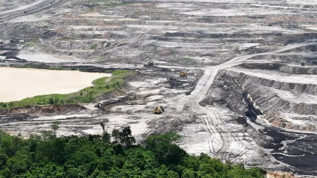 Aerial view of coal mining, land full of excavation holes