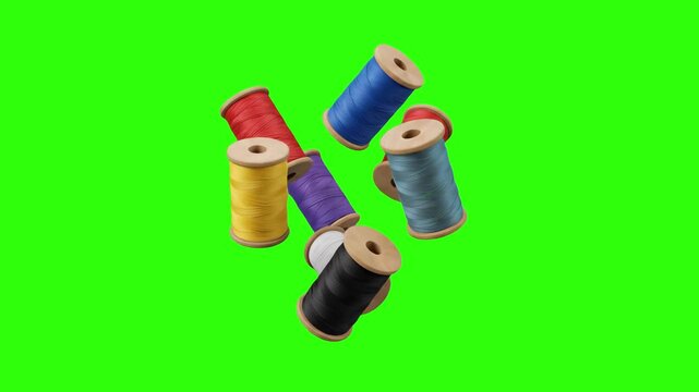 A dynamic cluster of vibrant, colorful wooden sewing thread spools floating in mid-air. Isolated against a chroma key green screen, this high-quality craft asset features red, blue, yellow, purple, cy
