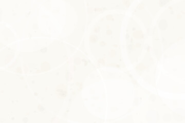 Fototapeta premium Overlapping white circles and faint circular bokeh dots on a pale beige background texture