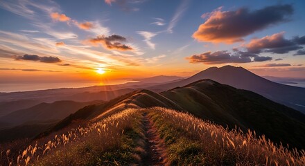 Fototapeta premium Breathtaking panoramic view of a mountain ridge during a vibrant golden sunset.