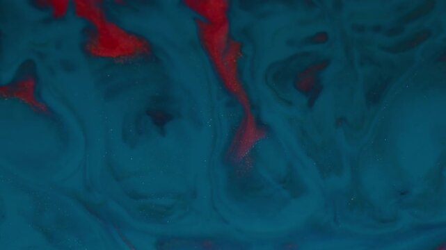 Ink wave. Color blend. Defocused red blue glitter shiny texture spatter liquid floating on abstract acrylic creative art background.