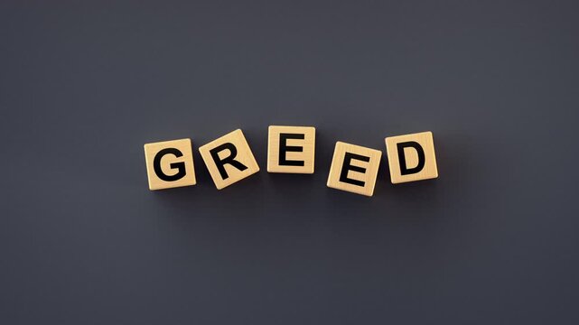 Greed Word Spelled with Wooden Letter Blocks. Concept of investor psychology, market sentiment, and the overbuying that can occur during a strong bull market or an economic bubble. 3D render animation