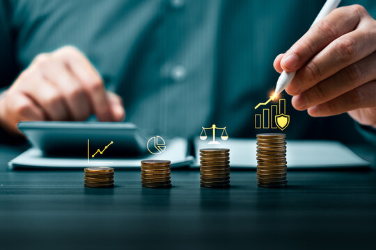 Financial risk management concept with hand using stylus on rising chart over coin stacks showing investment growth asset protection compliance balance and business strategy