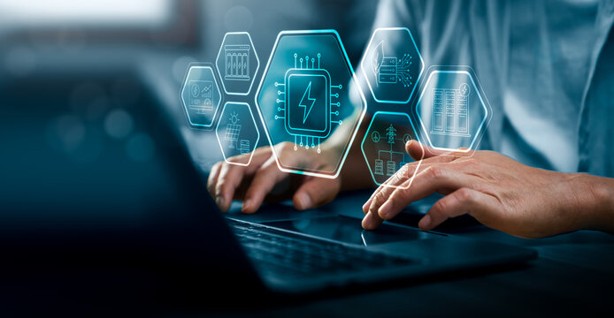 AI data center energy consumption concept with professional using laptop and digital power chip interface showing server infrastructure electricity usage efficiency and sustainable energy management