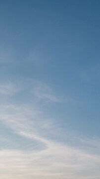 Beautiful evening clouds time-lapse, soft purple and pink sky background.