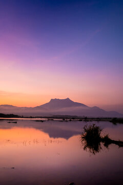 Morning at Reservoir with a mountain backdrop,reservoir featuring a large mountain formation in the background, Khlong Hin Reservoir, Krabi