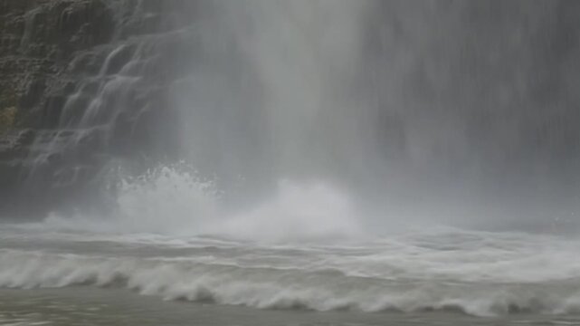 Stormy Ocean Waves Crashing on the Beach Under Dark Cloudy Sky with Wind, Rain and Dramatic Coastal Weather Scene