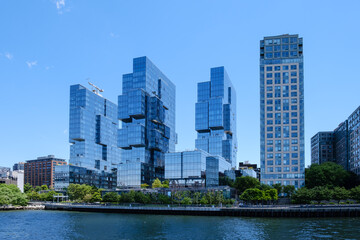Contemporary glass residential towers of Eagle plus West at Greenpoint Landing waterfront, looking across East River from Manhattan, New York City. © Olivier