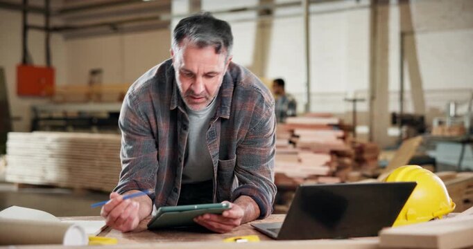 Tablet, furniture and laptop with man in workshop for carpenter inventory, research or artisan. Woodworking checklist, quality assurance and online report with mature person in factory for production