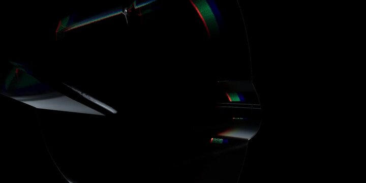Abstract dark background with glowing neon light curves and colorful digital motion lines in shadows