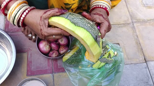 a woman cutting wax gourd for food