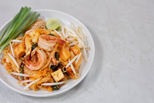 Authentic Pad Thai Noodles with Shrimp Served on White Plate Traditional Thai Cuisine