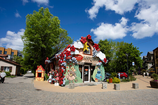 Zelenogradsk, Russia - June 3, 2026: The Marzipan factory's flagship store, decorated in a fairytale-like style with flowers and mushrooms. The facade features images of rabbits.