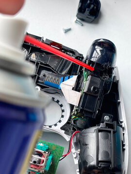 Cleaning and repairing game controller joystick, gaming maintenance and electronics repair concept