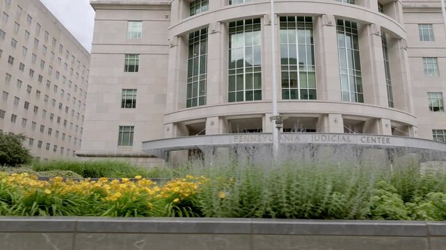Exterior of Pennsylvania Judicial Center in Harrisburg, Pennsylvania with drone moving low left to right.