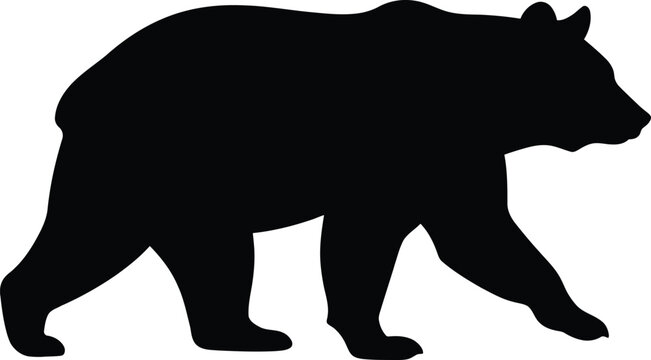 Silhouette of a walking bear in profile view