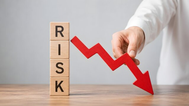 Financial risk management and intervention concept with a hand pressing down a red decreasing arrow graph