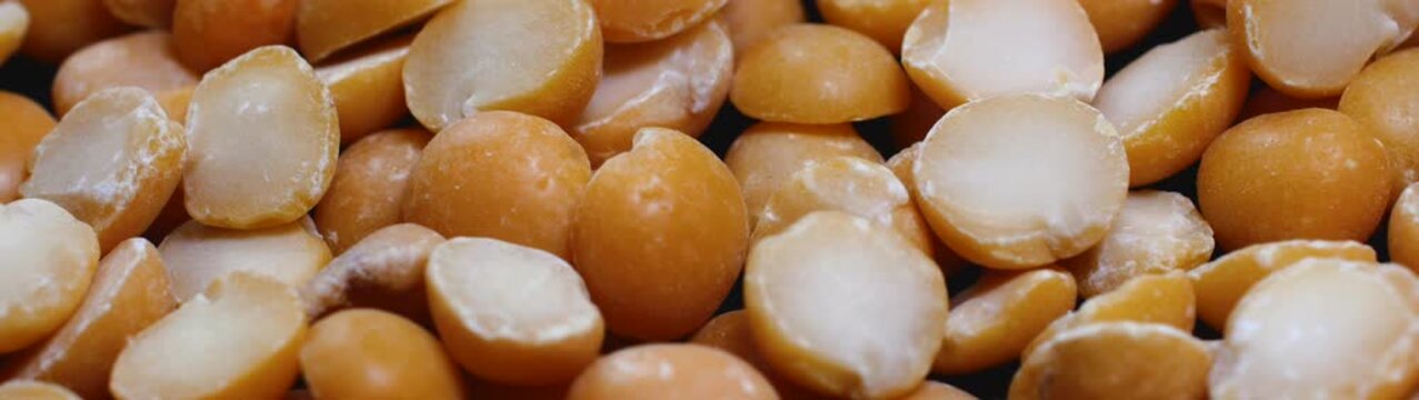 Dried yellow split peas a staple legume showing their rich golden appearance and texture ready for culinary use.