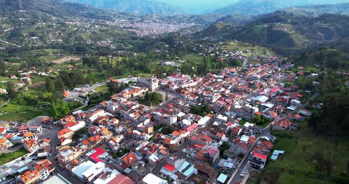 This stunning aerial footage captures the beautiful artisan town of Chordeleg, located in the Azuay province of Ecuador, on a bright and sunny day. Known for its exquisite silver filigree jewelry, tra