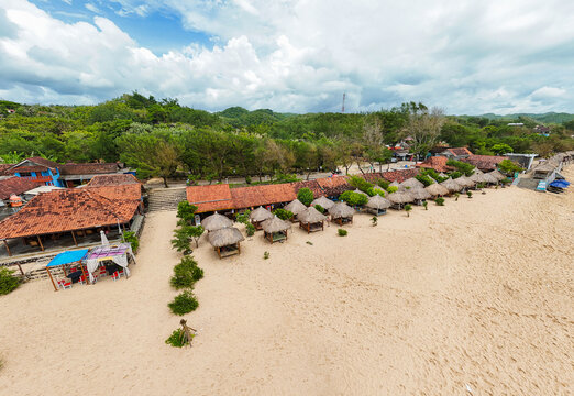 Drone perspective of a beautiful coastal beach resort setup in Gunungkidul Beach