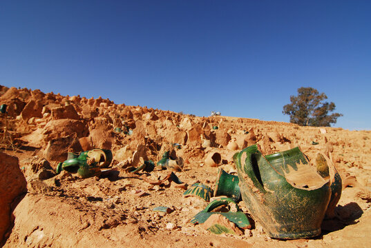 Algeria, Ghardaia, broken pots on an arid landscape