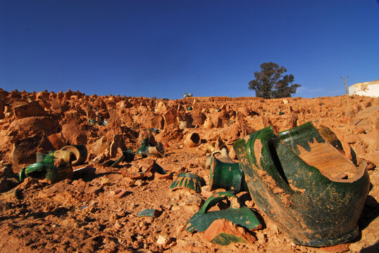 Algeria, Ghardaia, broken pots on an arid landscape