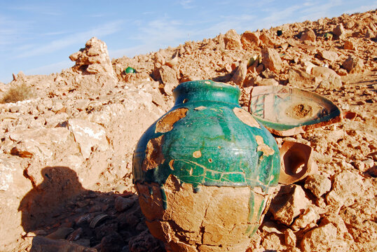 Algeria, Melika, broken pots on landscape in desert