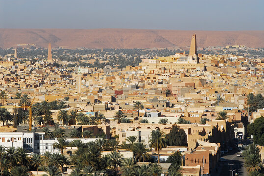 Algeria, Melika, high angle view on Ghardaia of vehicles moving on road by houses in city